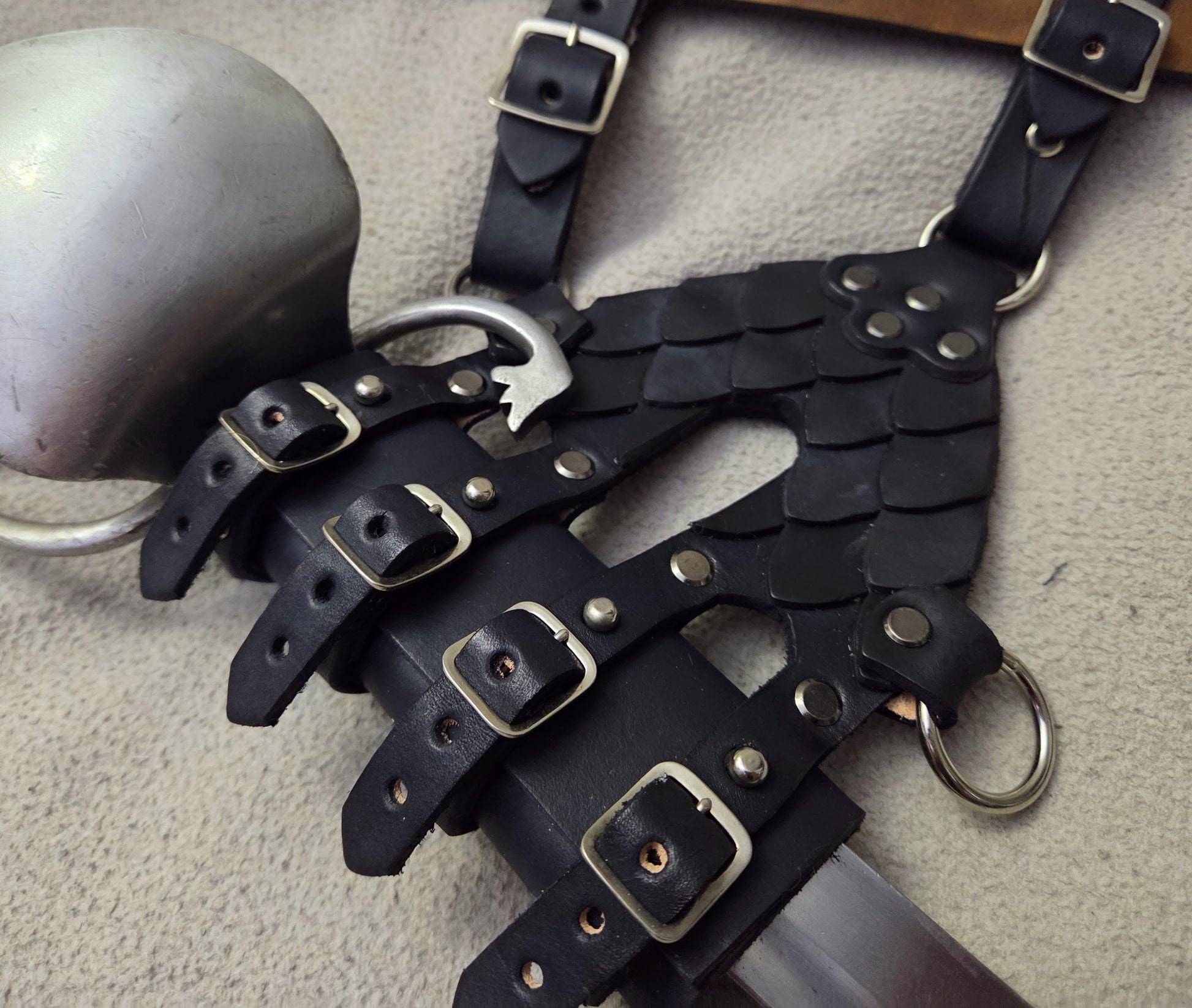 leather sword frog with scales on it